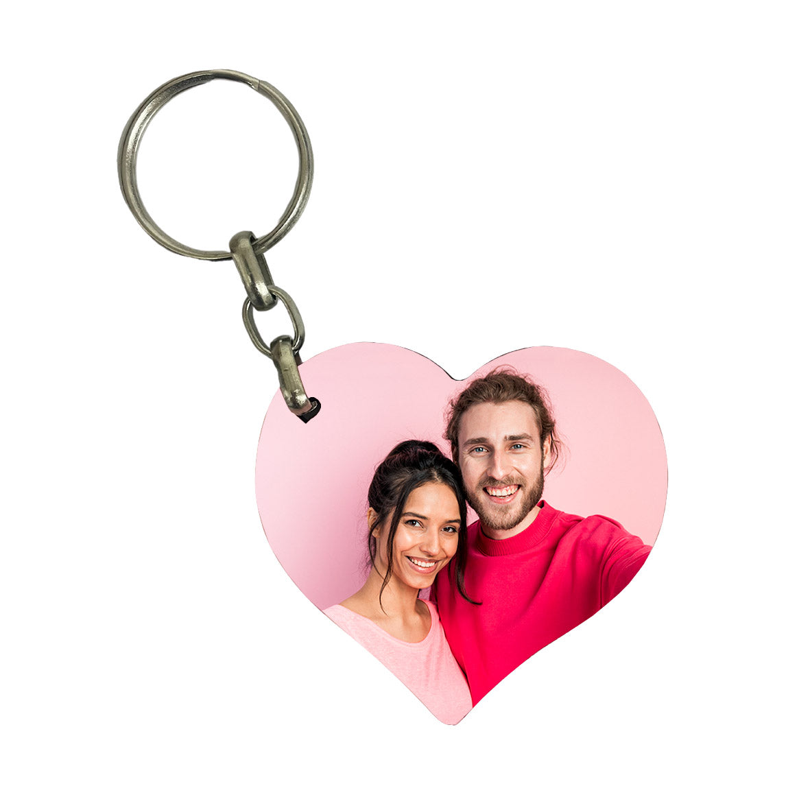 Heart-shaped keychain with a photo of a couple on a white background